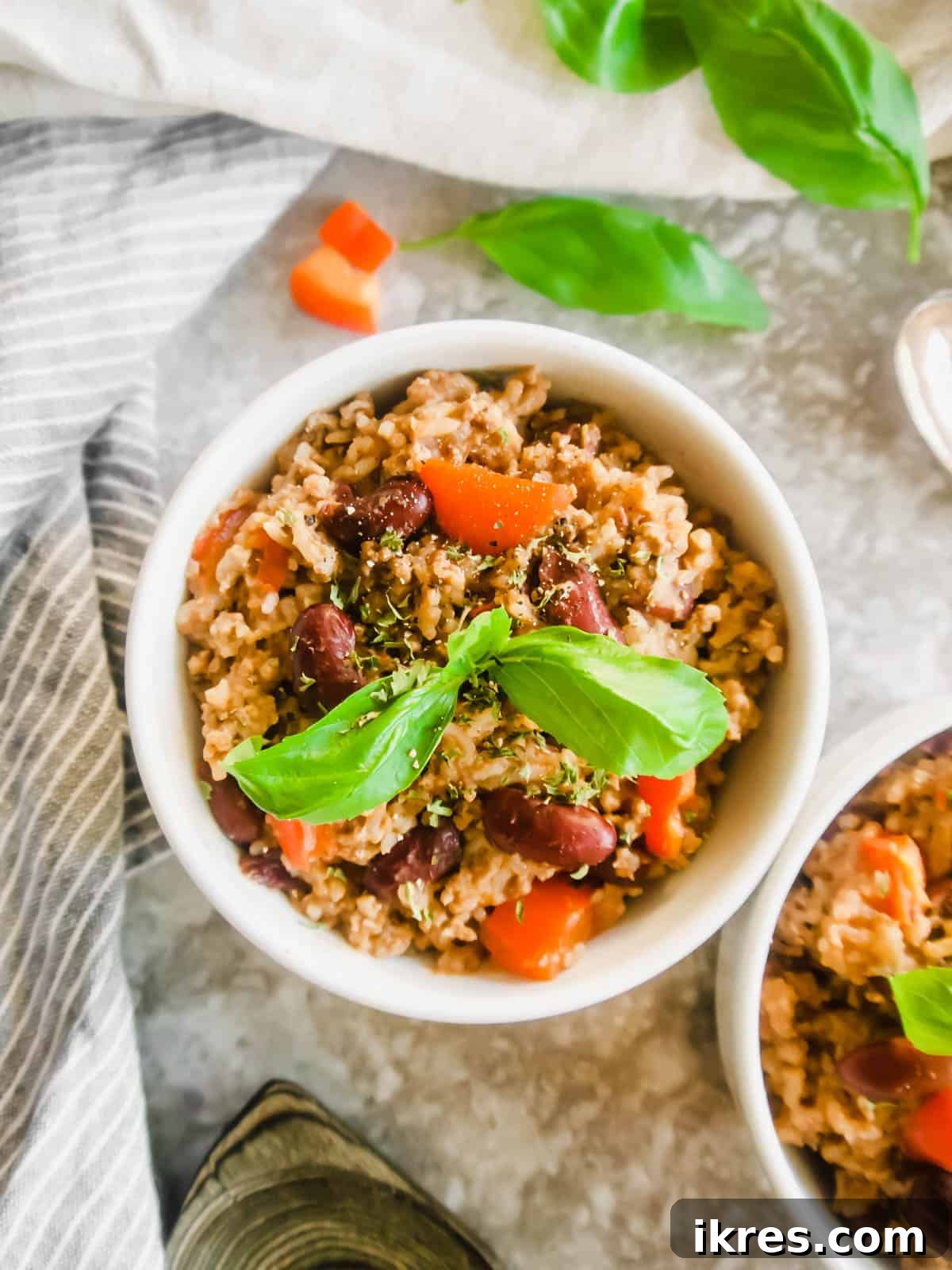 One Pot Wonder Ground Turkey Rice and Beans Gluten Free 4 Ground Turkey, Rice and Beans served in two ceramic bowls, garnished with fresh cilantro.