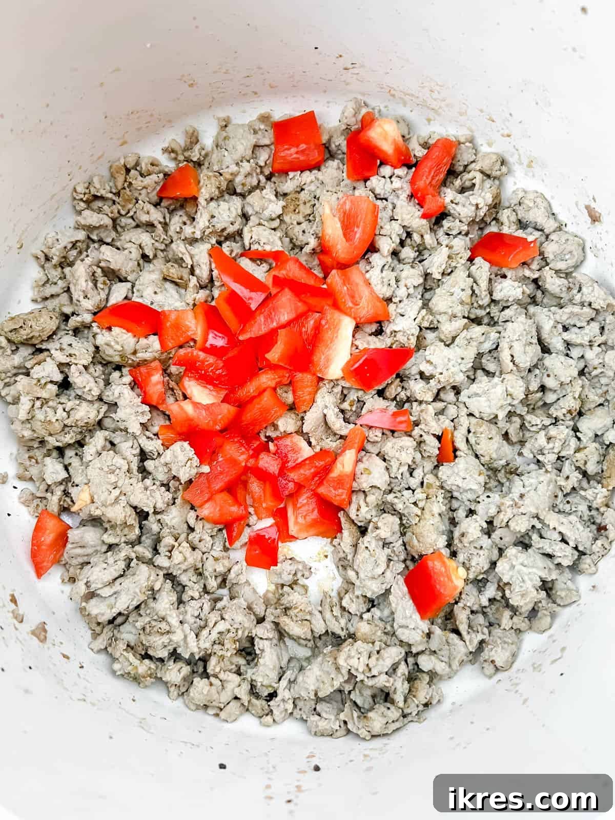 One Pot Wonder Ground Turkey Rice and Beans Gluten Free 6 Bell peppers added to the browned ground turkey in the pot, ready to soften.
