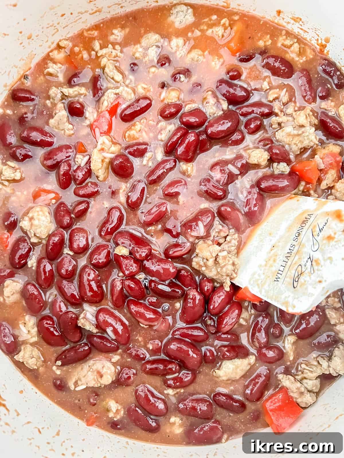 One Pot Wonder Ground Turkey Rice and Beans Gluten Free 8 Chicken broth, rice, and kidney beans combined with turkey mixture in the pot.