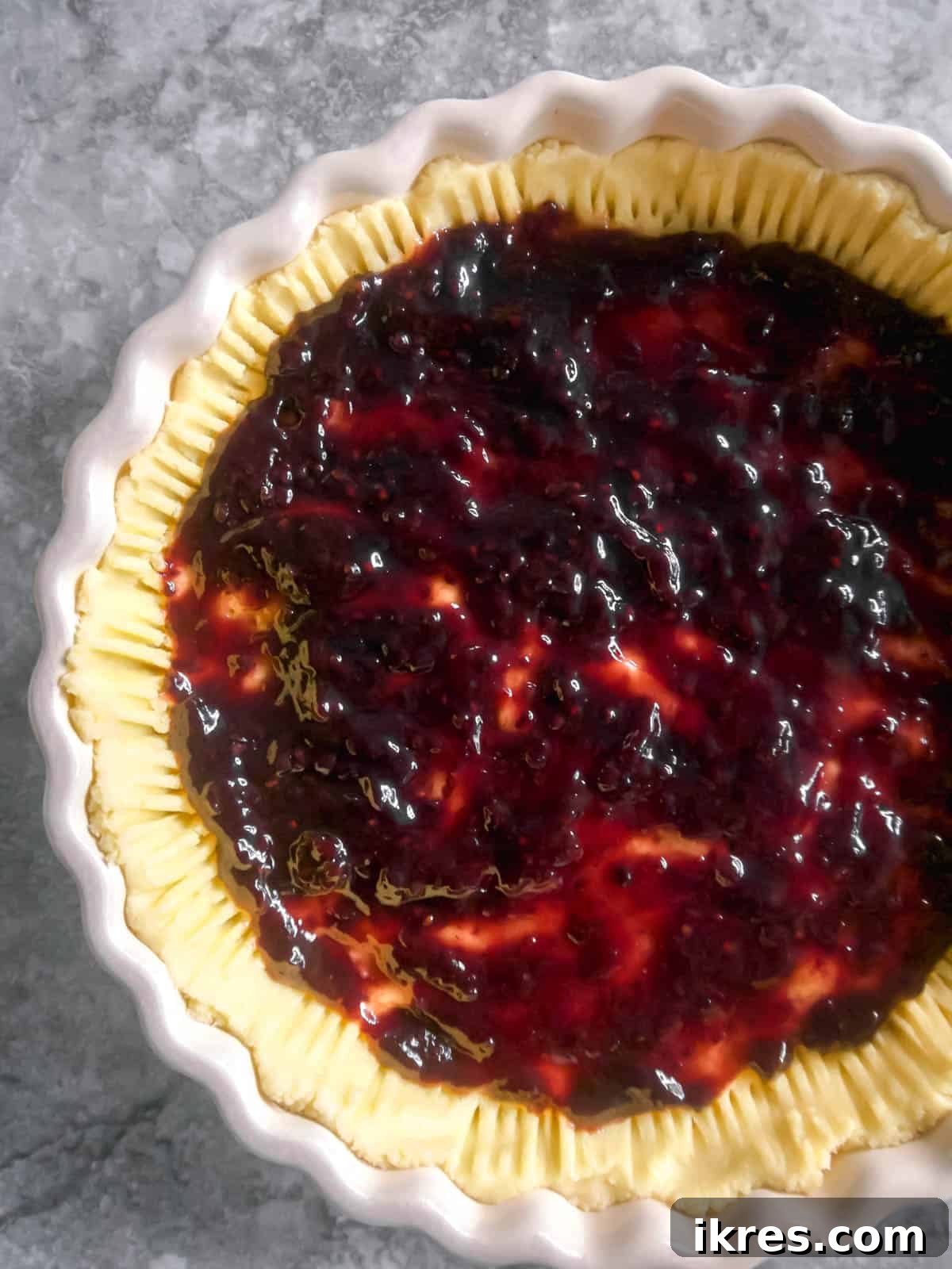Jam evenly spread on top of the tart crust.