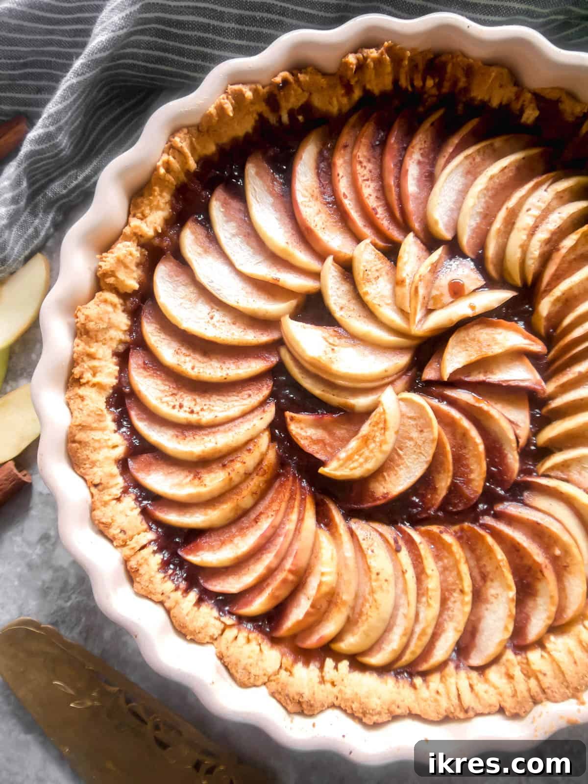 Freshly baked healthy apple tart, golden and glistening.