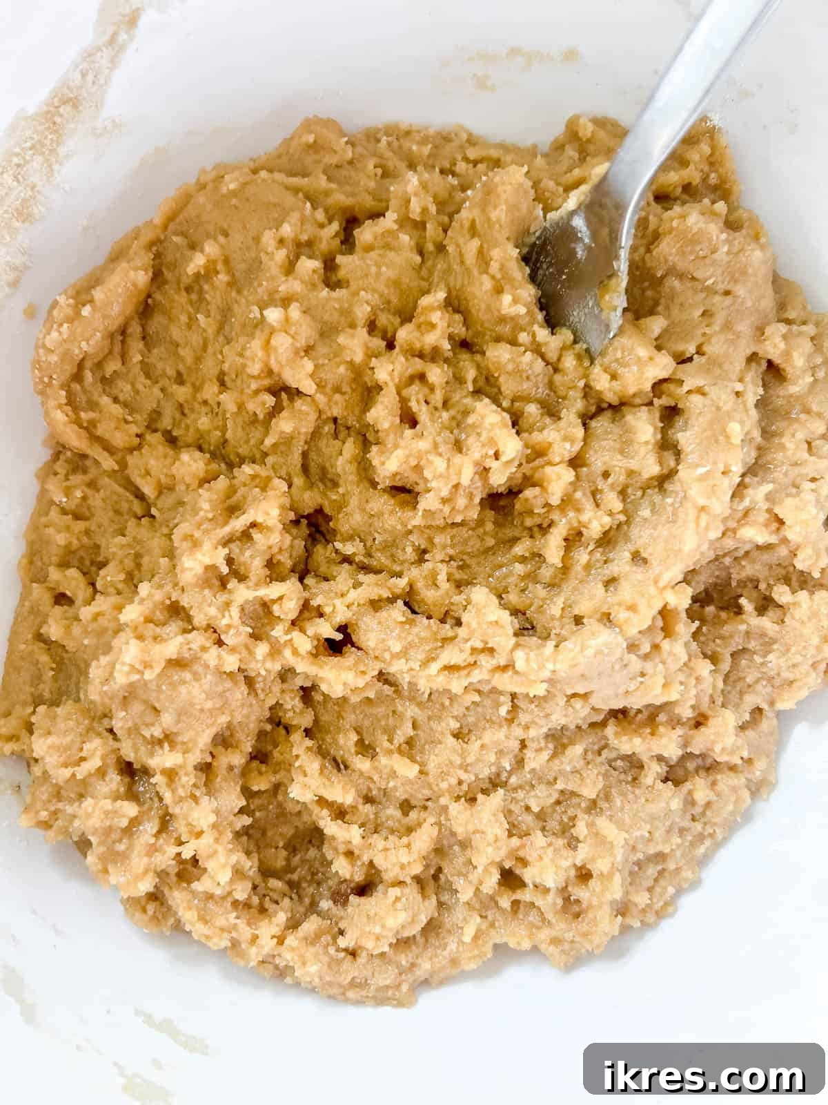 Ultimate Gluten-Free Dairy-Free Chocolate Chip Cookie Bars 6 Raw gluten-free cookie bar dough forming after combining wet and dry ingredients.
