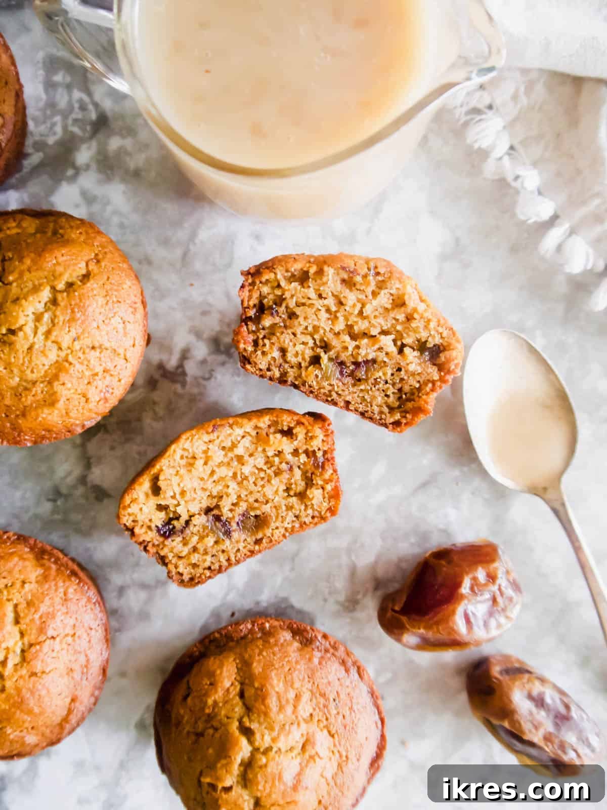 Decadent Gluten-Free Dairy-Free Sticky Toffee Muffins 4 Paleo sticky toffee pudding dessert muffins arranged artfully on a table, ready to be served.