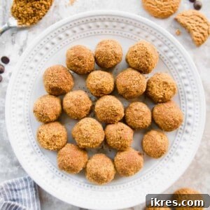 Decadent Gluten-Free Dairy-Free Chocolate Mousse Truffles 10 Chocolate mousse balls on a plate with crumbs, cookies and chocolate on the table.