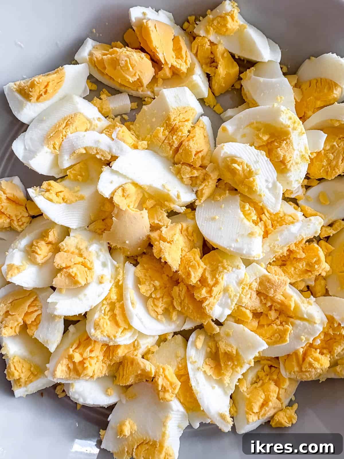 Chopped hard-boiled eggs in a bowl.