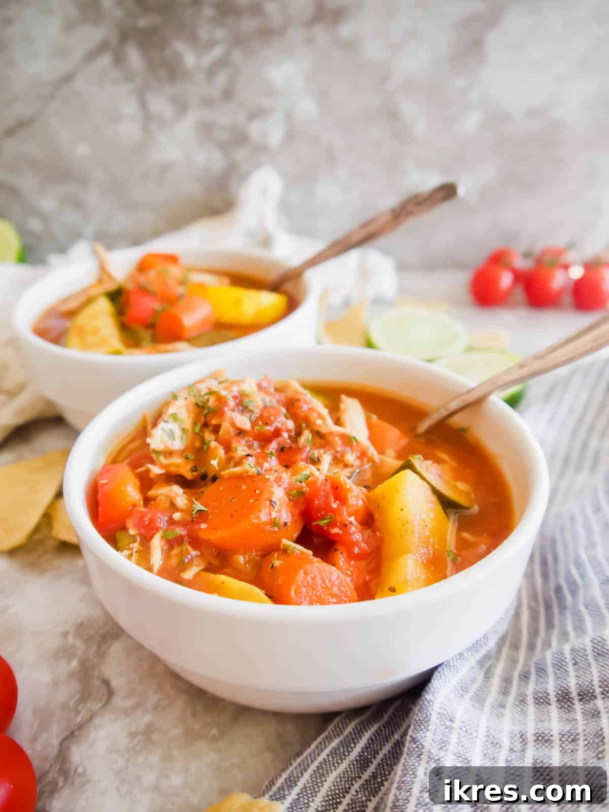 Hearty Slow Cooker Chicken and Veggie Chili 3 Slow Cooker Shredded Chicken and Vegetable Chili | A close-up shot of the chili cooking in the slow cooker, showing the rich tomato base and spices. This image highlights the simplicity and deliciousness of a healthy, homemade chili recipe.