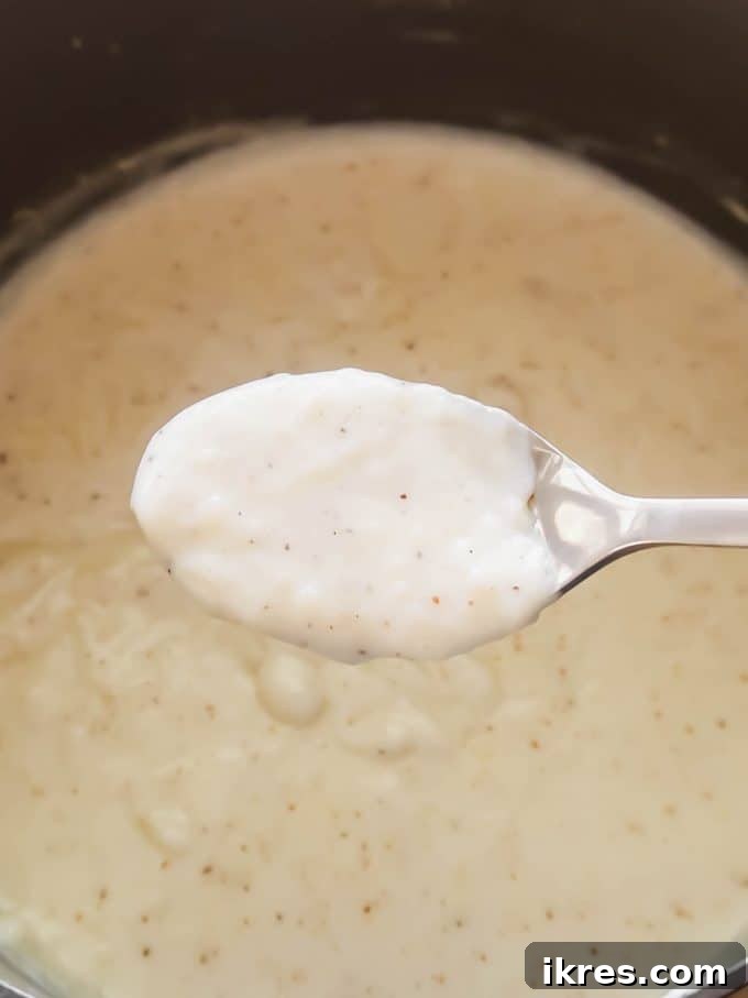 The initial stages of making the creamy sauce for the creamed peas, showing butter and flour mixing.