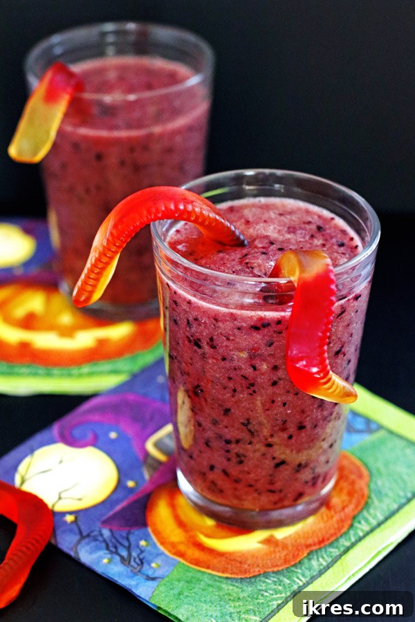 The Ultimate Purple Powerhouse 3 Another perspective of the purple smoothie, showing the delightful gummy worms peeking out from the top, inviting kids to take a sip.