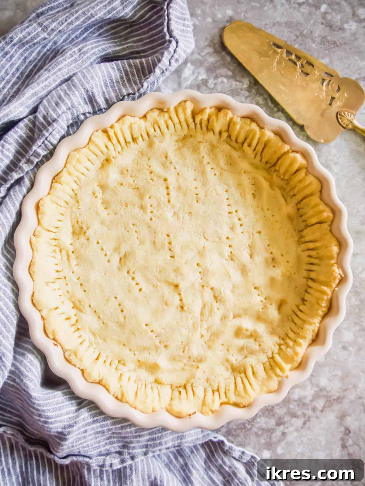 Simple Paleo Pie and Tart Crust Naturally Gluten and Dairy Free 3 Paleo pie crust just removed from the oven, showcasing its golden edge.