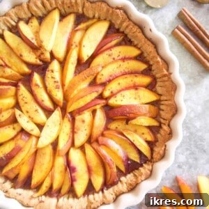 Nectarine tart with serving spatula next to it.