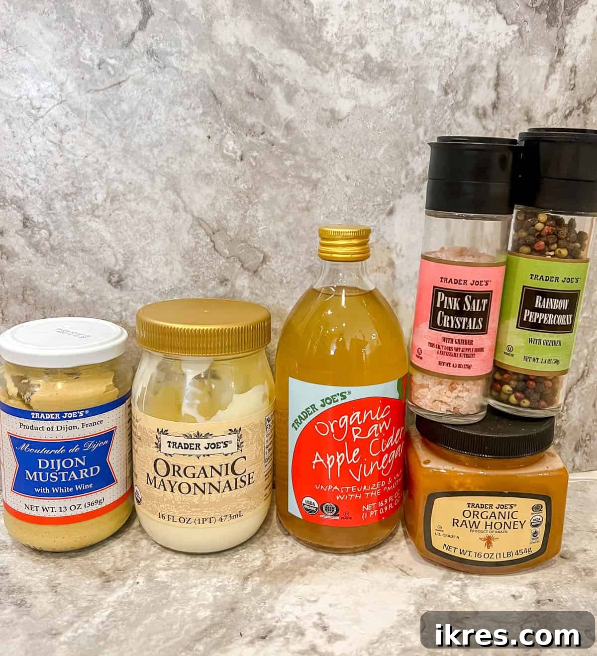 Ingredients for the creamy dressing: mayonnaise, dijon mustard, apple cider vinegar, and honey.