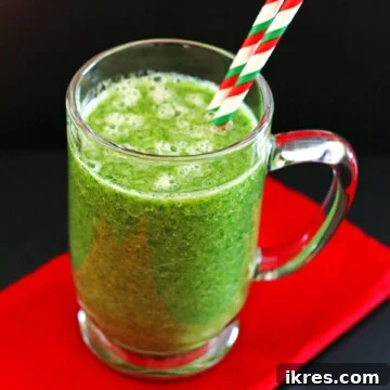A green smoothie made with orange, banana, greens, water, & flaxseed.