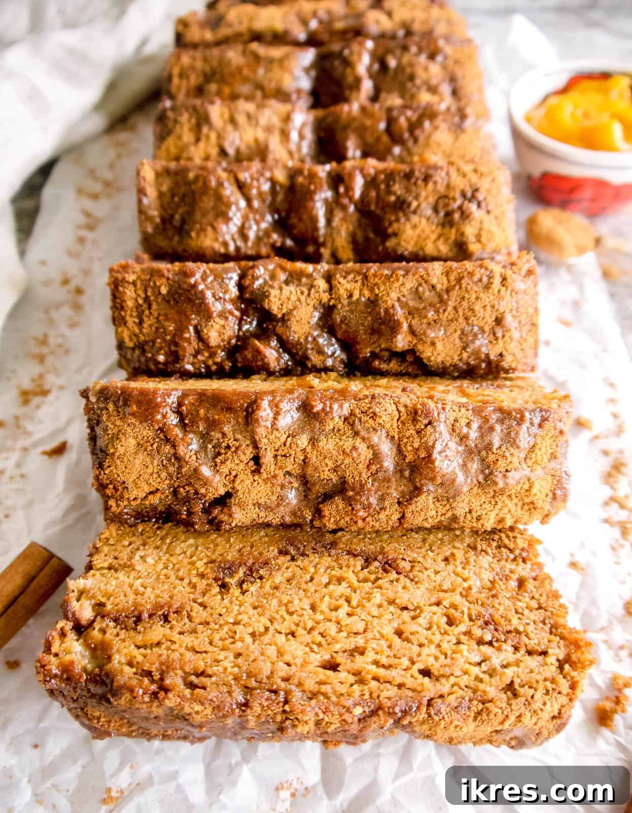 Wholesome Paleo Cinnamon Swirl Pumpkin Banana Bread 2 Paleo pumpkin banana bread recipe with swirls of cinnamon and coconut sugar, presented beautifully on a cutting board.
