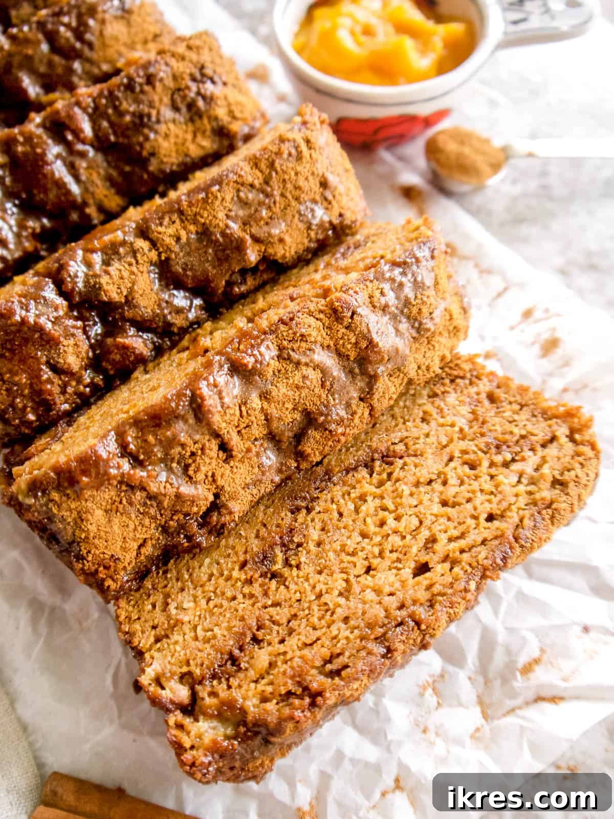Wholesome Paleo Cinnamon Swirl Pumpkin Banana Bread 3 A perfectly baked gluten-free pumpkin banana bread, sliced into inviting pieces, ready to be enjoyed.