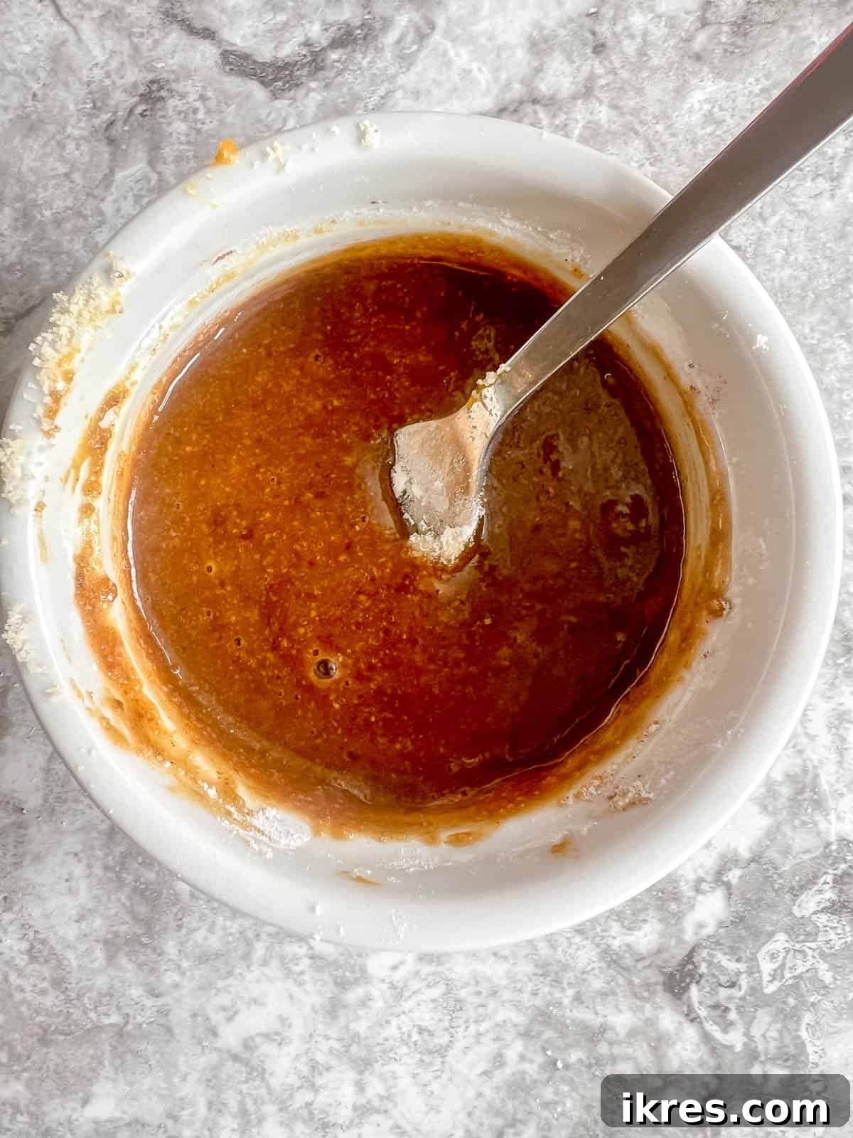 Easy Paleo Pumpkin Spice Mug Cake 7 Almond flour, tapioca flour, and pumpkin pie spice added to the wet ingredients in a ramekin.