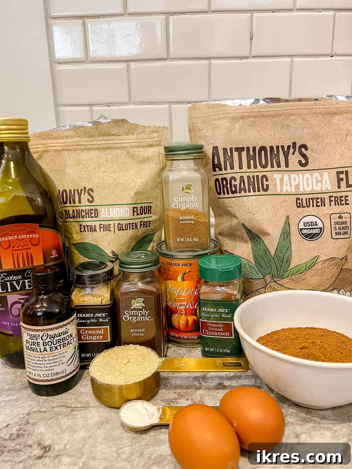 Ingredients neatly arranged for making Paleo pumpkin muffins, highlighting each component.