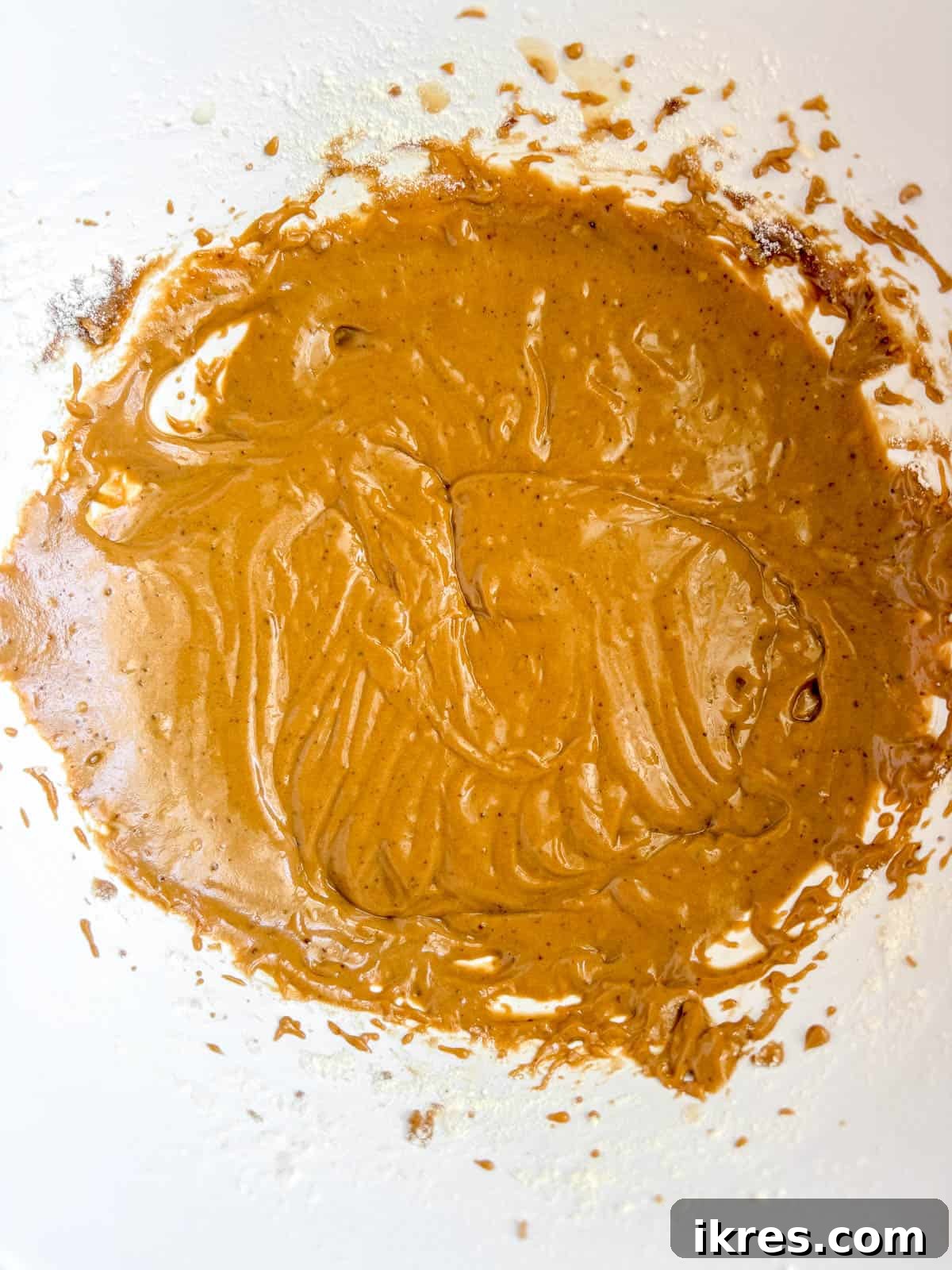 Naturally Dairy-Free Olive Oil Blueberry Muffins 6 Muffin batter being mixed with dry ingredients and almond milk.