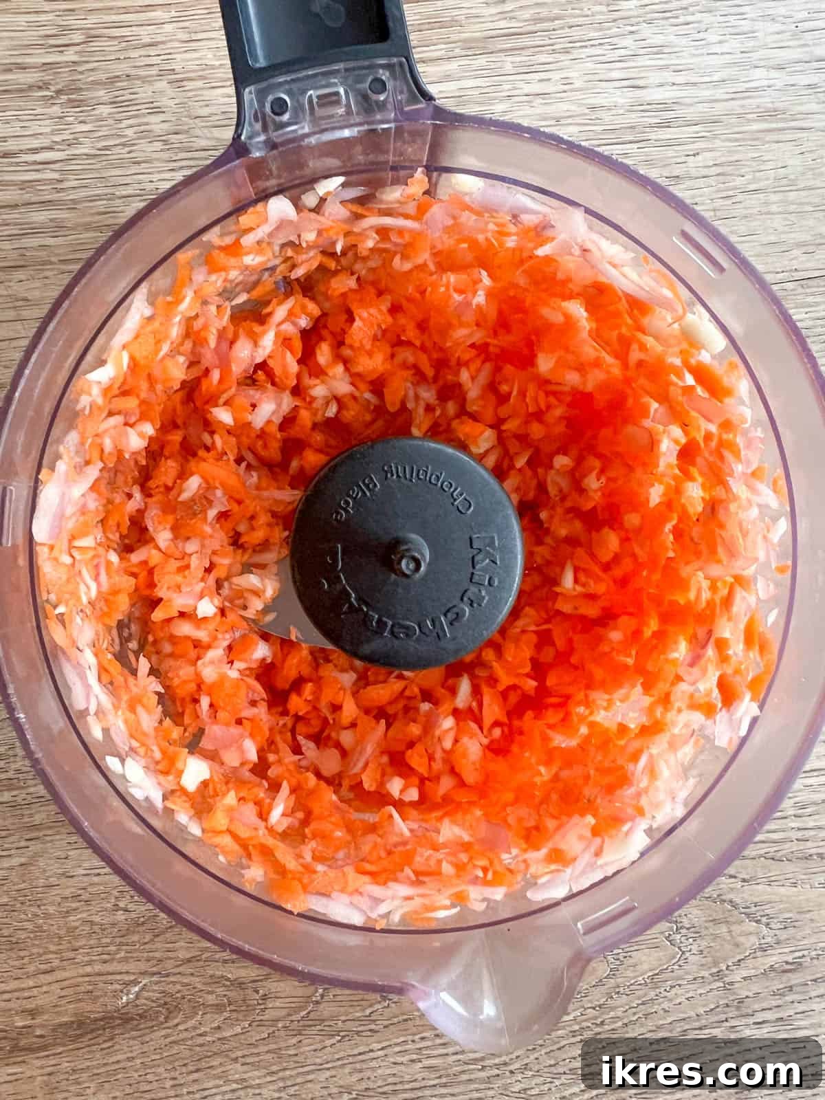 Lean Poultry Power Meatloaf 4 Minced carrots, garlic, and shallot in a food processor.