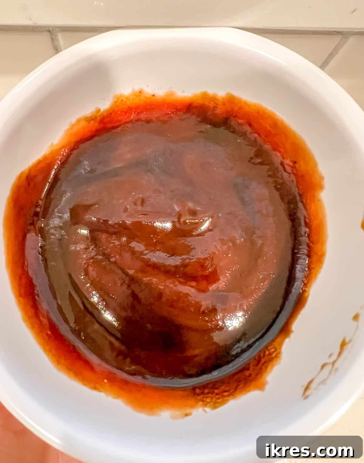 Ketchup and blackstrap molasses sauce in a small bowl.