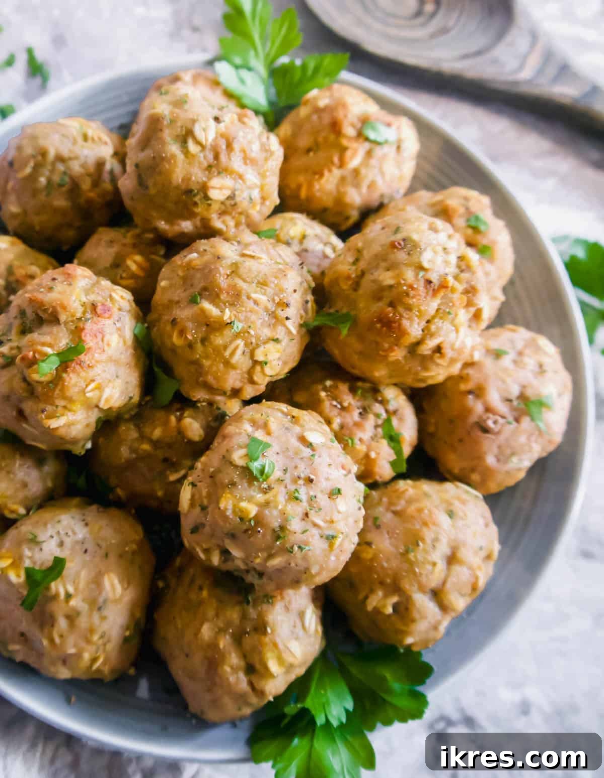 Gluten Free Dairy Free Turkey Meatballs with Oats 2 A large bowl filled with perfectly baked Ground Turkey Meatballs with Oats, ready to be served.