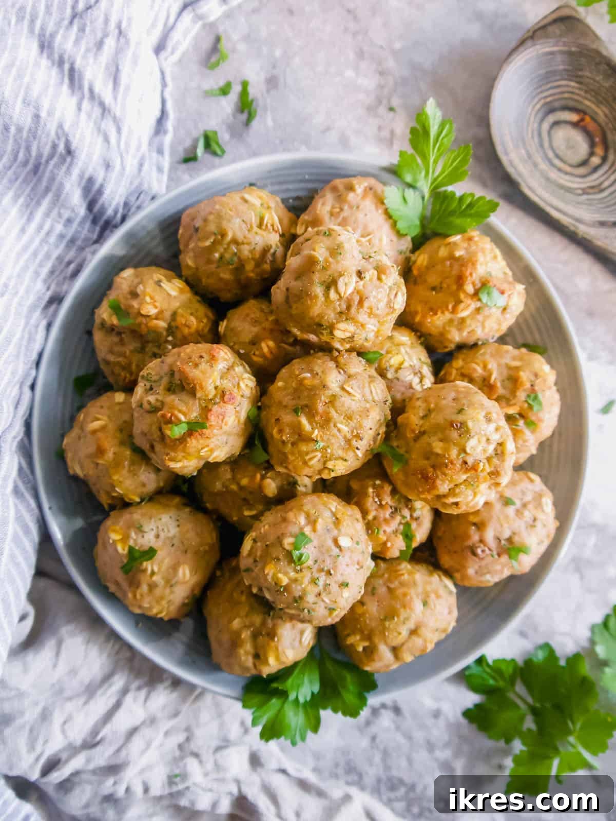 Gluten Free Dairy Free Turkey Meatballs with Oats 9 An inviting aerial view of gluten-free turkey meatballs nestled in a bowl, perfectly arranged.