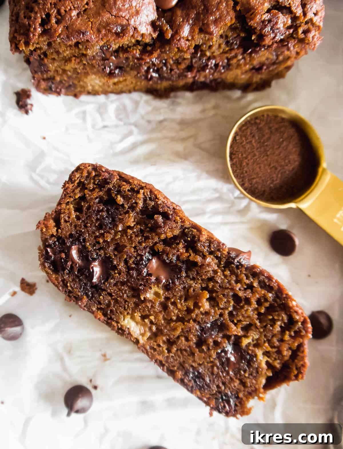 Decadent Espresso Chocolate Chip Banana Bread Paleo Gluten Free Dairy Free 3 A whole loaf of paleo banana bread with espresso and chocolate chips, ready to be sliced.