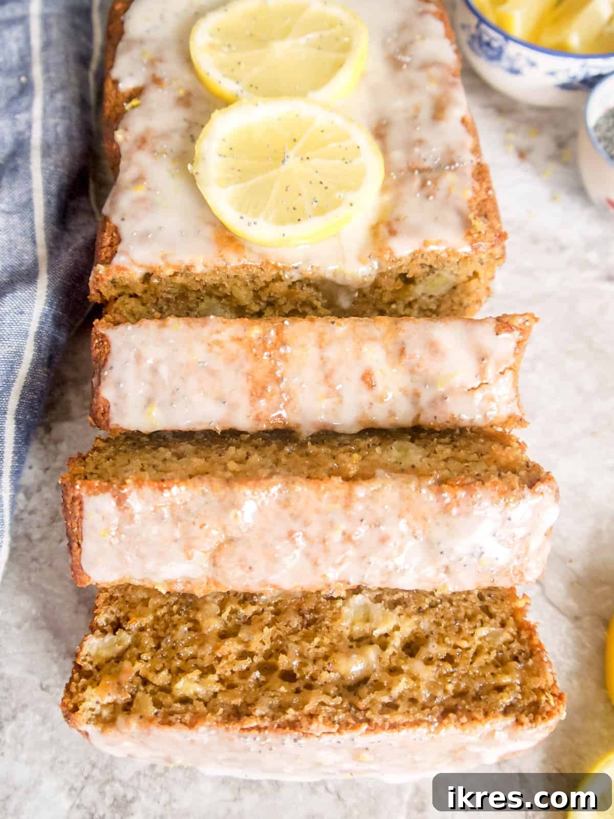 Zesty Paleo Lemon Poppy Seed Banana Bread 11 A beautifully presented whole loaf of Lemon Poppyseed Banana Bread with a vibrant glaze.