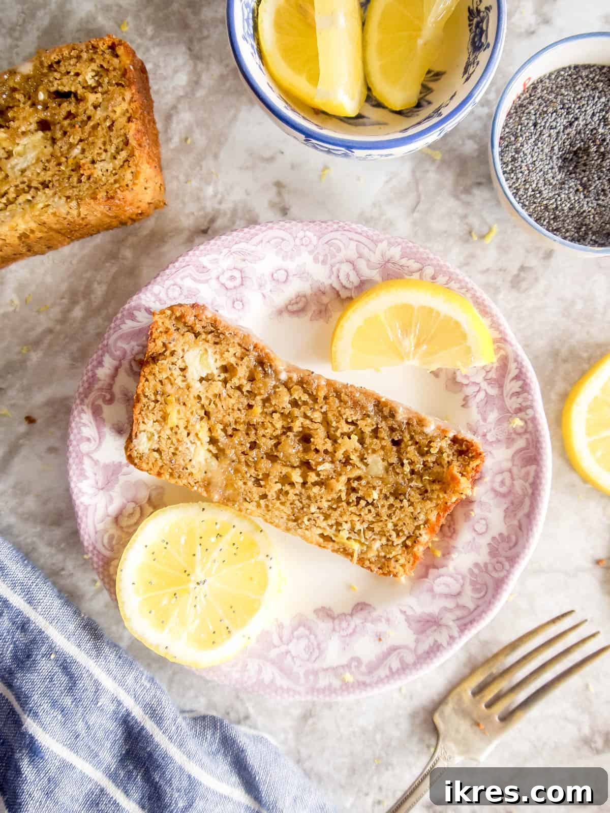 Zesty Paleo Lemon Poppy Seed Banana Bread 6 A close-up view of a slice of lemon poppy seed banana bread, highlighting its moist crumb and citrusy aroma.
