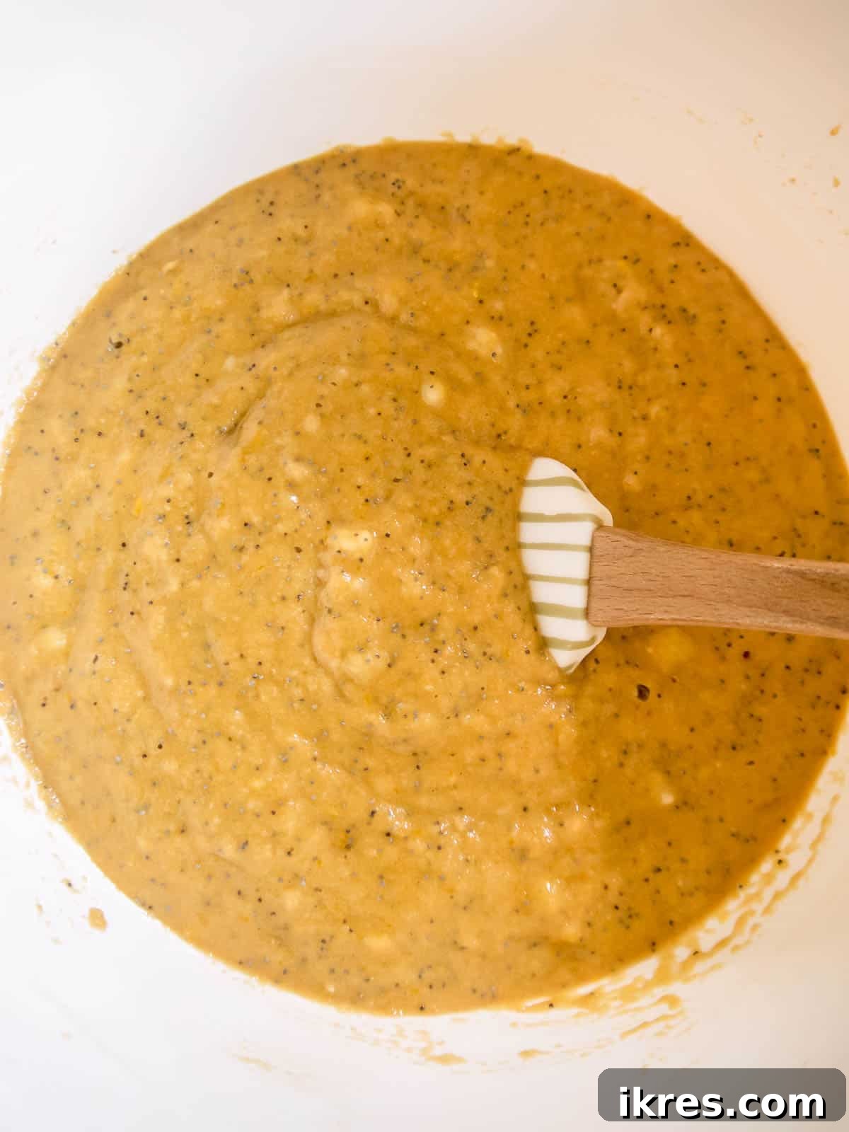 Zesty Paleo Lemon Poppy Seed Banana Bread 7 The prepared paleo lemon banana bread batter in a mixing bowl, ready for the baking pan.
