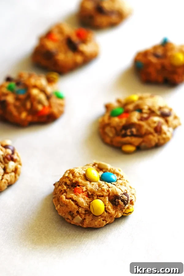 A stack of golden brown Trail Mix Cookies, showcasing their appealing texture.