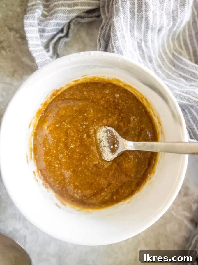 Guilt-Free Paleo Mug Cookie Delight 4 The initial batter of almond flour, coconut sugar, and olive oil mixed in a mug.