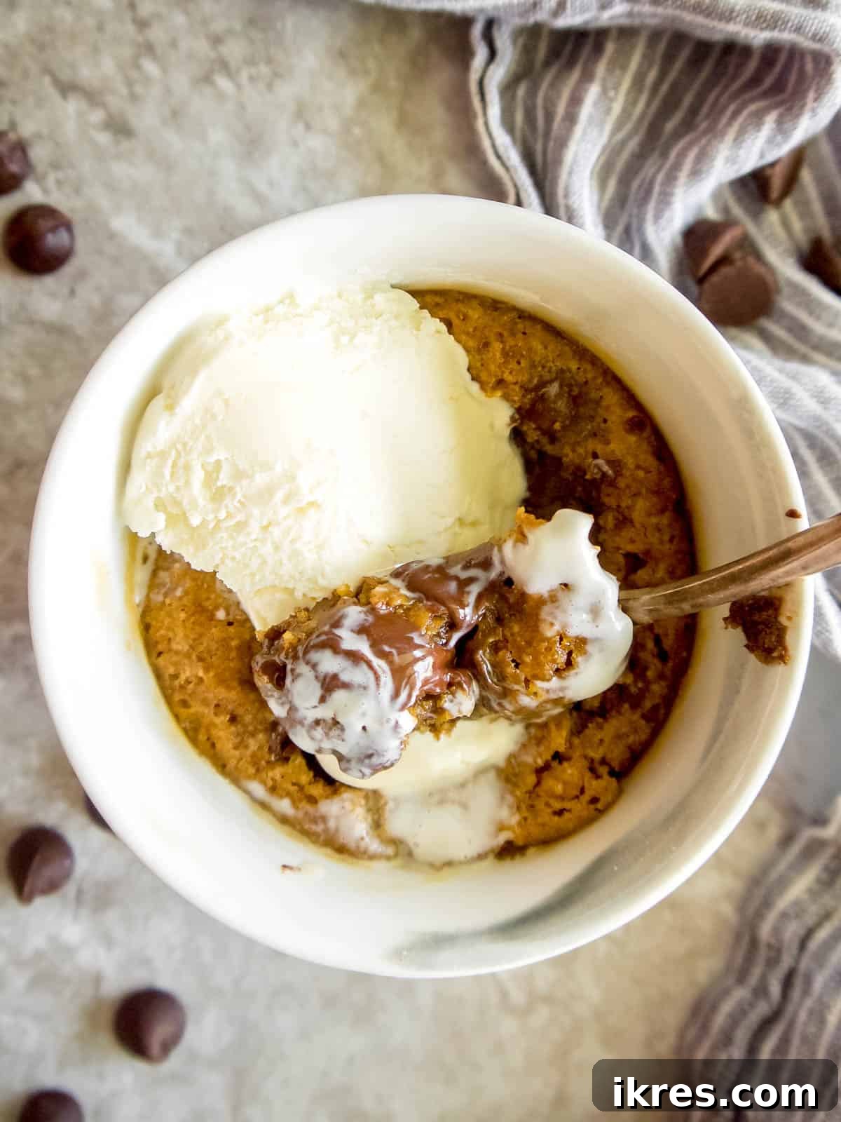 Guilt-Free Paleo Mug Cookie Delight 8 A healthy mug cookie topped with a scoop of dairy-free ice cream, ready to be enjoyed.