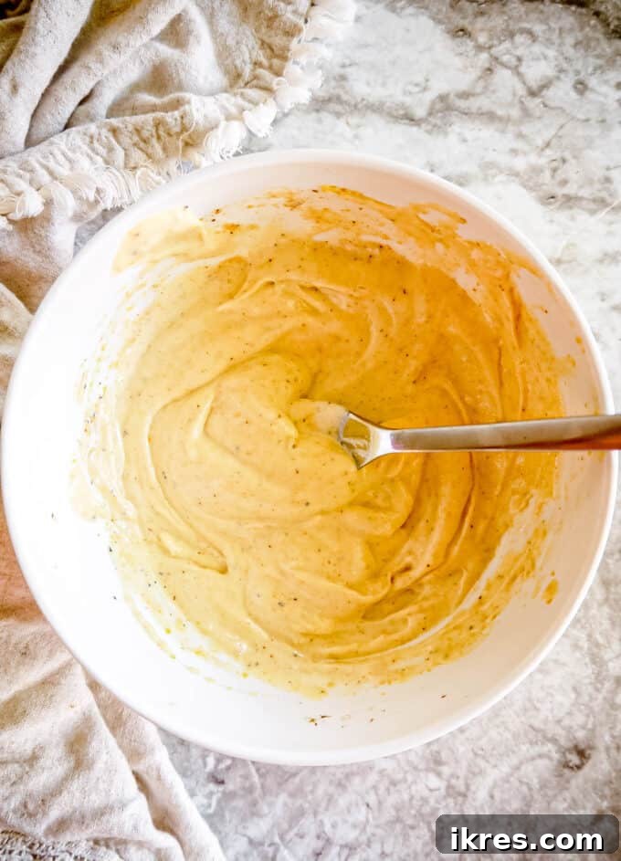 The lime mayo sauce in a bowl, creamy and well-mixed.