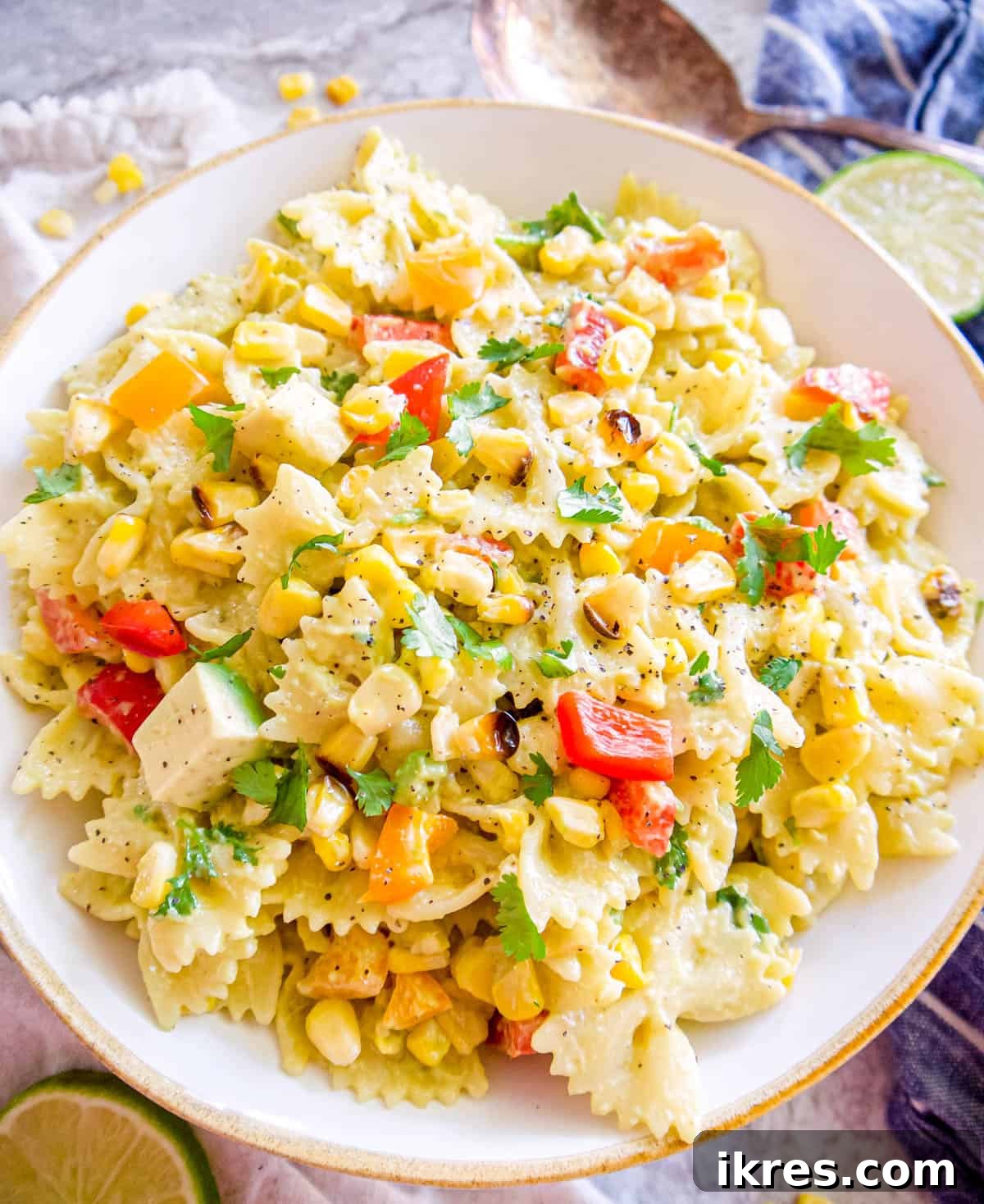 Freshly made dairy free pasta salad with roasted corn, ready to be enjoyed.