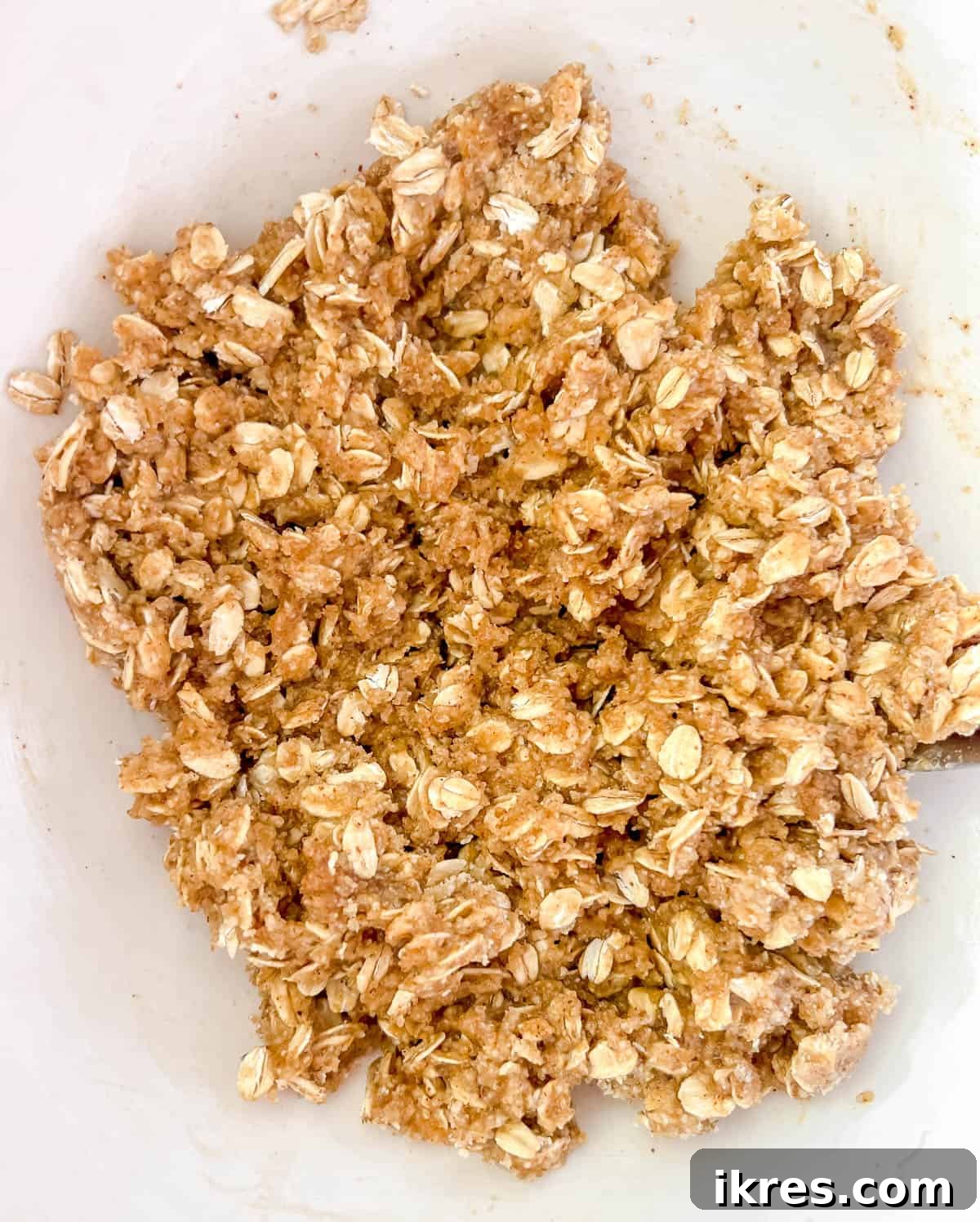 Wholesome Gluten Free Dairy Free Almond Oatmeal Treats 7 The combined wet and dry ingredients forming a cohesive almond oatmeal cookie dough.