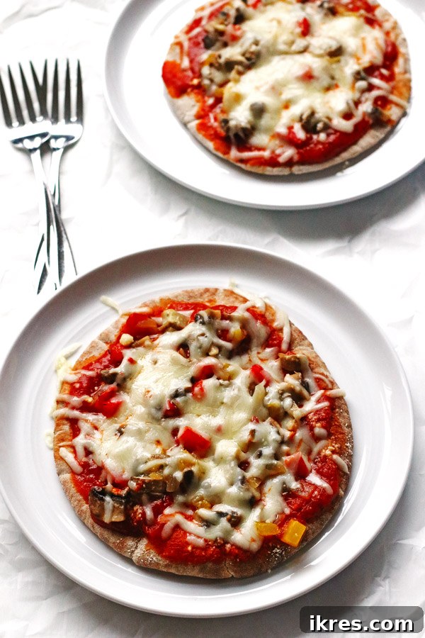 Garden Flatbread Pizza 3 This recipe for Veggie Pita Pizzas are made on whole wheat pitas and covered with peppers, onions, mushrooms and cheese.