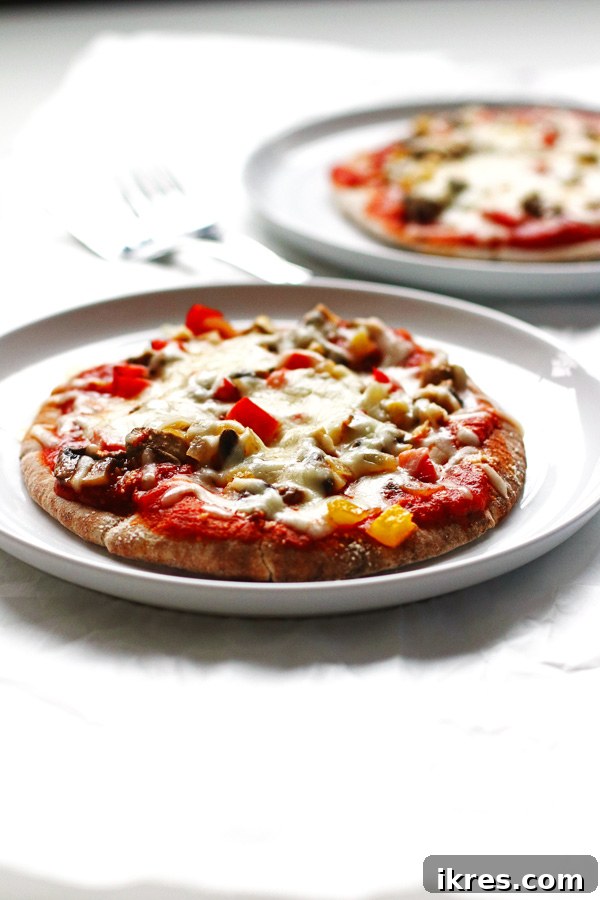 Garden Flatbread Pizza 4 This recipe for Veggie Pita Pizzas are made on whole wheat pitas and covered with peppers, onions, mushrooms and cheese.