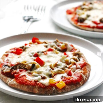 Garden Flatbread Pizza 5 This recipe for Veggie-Pita-Pizza makes individual pizzas. They are made with whole wheat pitas and covered with peppers, onions, mushrooms and cheese.