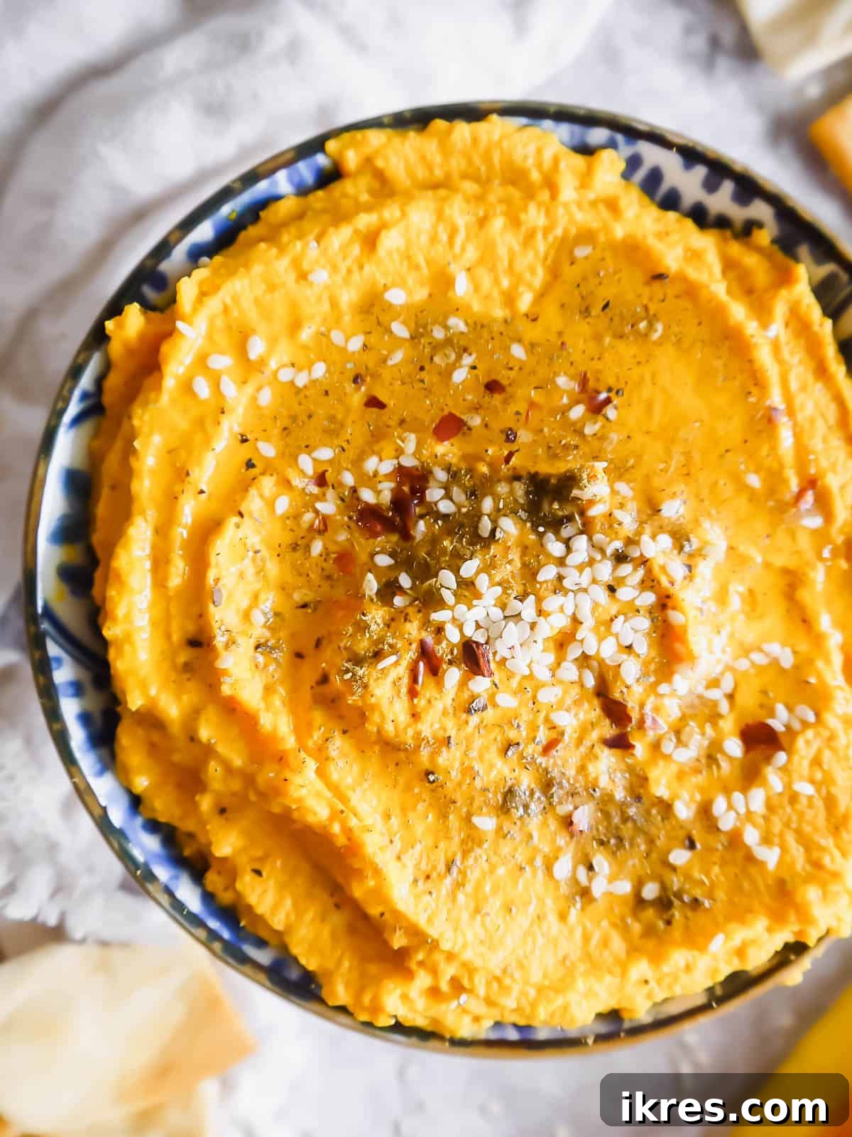 Up close aerial view of vegan carrot hummus.