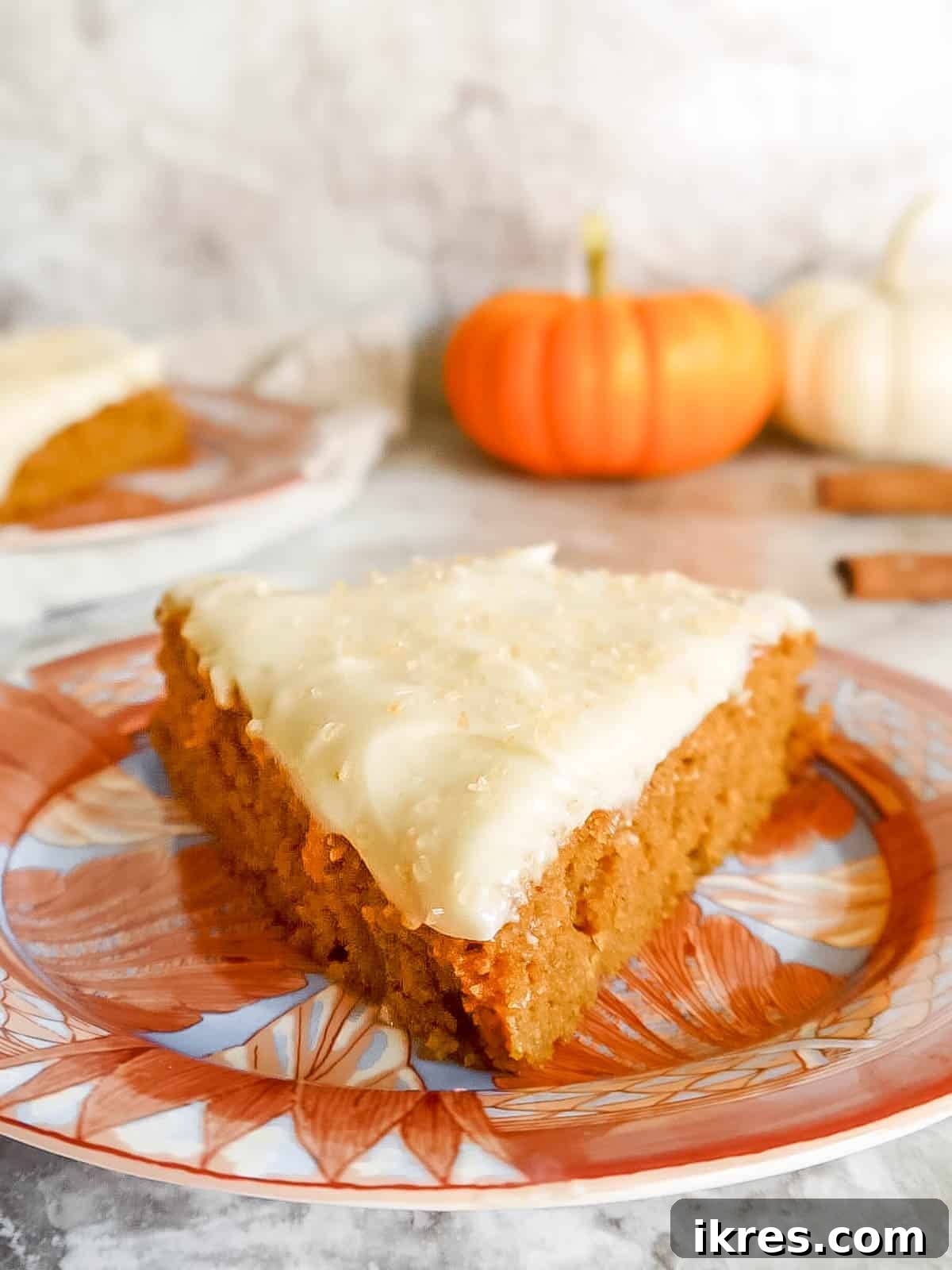 Artisanal Pumpkin Olive Oil Cake 3 A stunning front view of the gluten-free pumpkin cake, elegantly frosted and ready to be served.