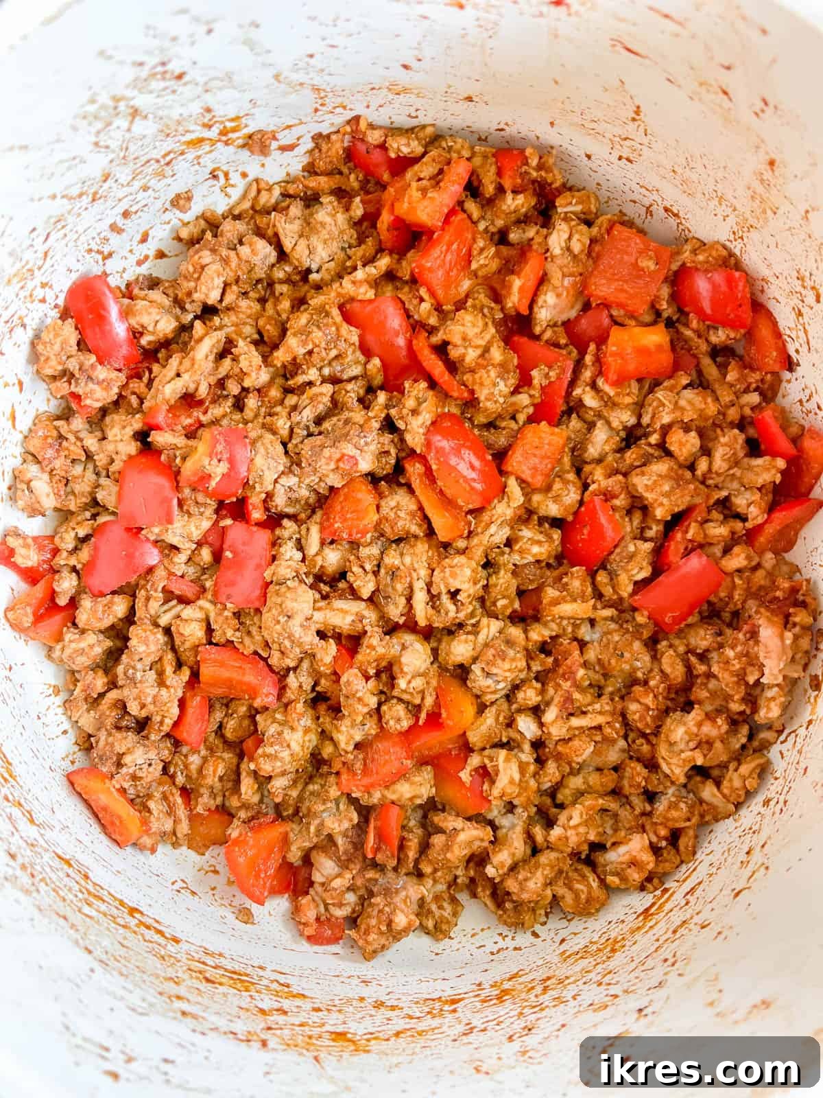 Hearty Turkey Chili with Butternut Squash and Black Beans 6 Well-browned ground turkey mixed with softened bell pepper in a large pot, forming a flavorful base for the chili.