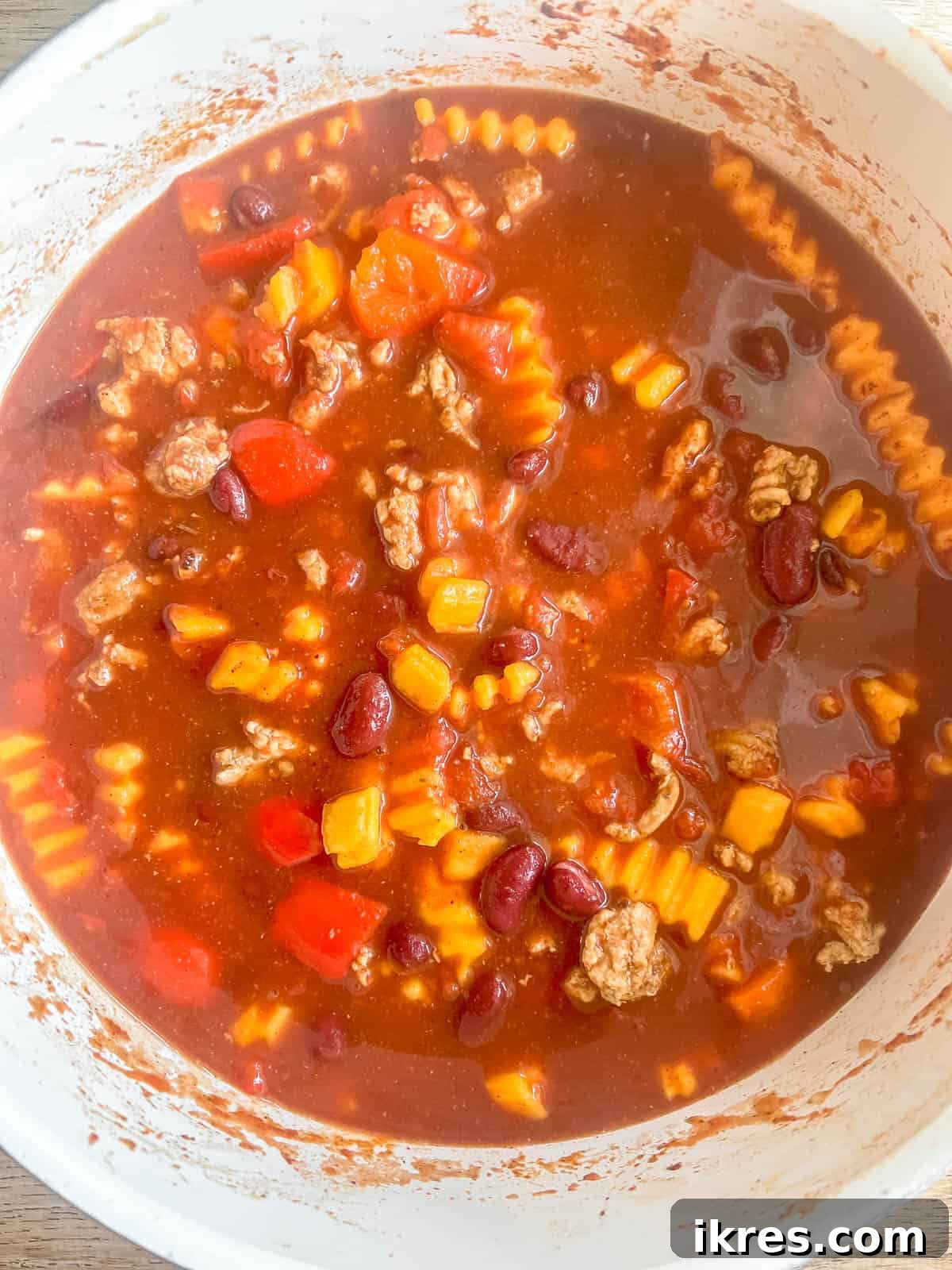 Hearty Turkey Chili with Butternut Squash and Black Beans 8 The rich, red tomato sauce, beans, and butternut squash simmering gently in the pot, allowing flavors to meld and the squash to tenderize.