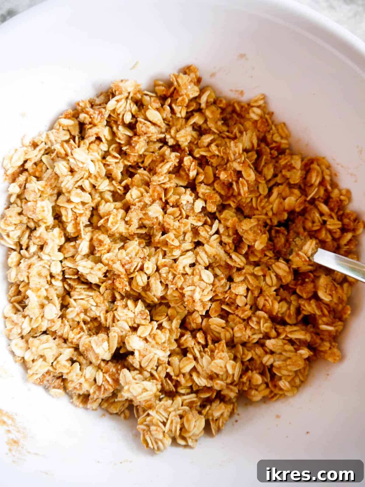 Spiced Pear Cranberry Crisp 6 Almond flour and oat crisp topping mixture in a bowl, before adding wet ingredients.