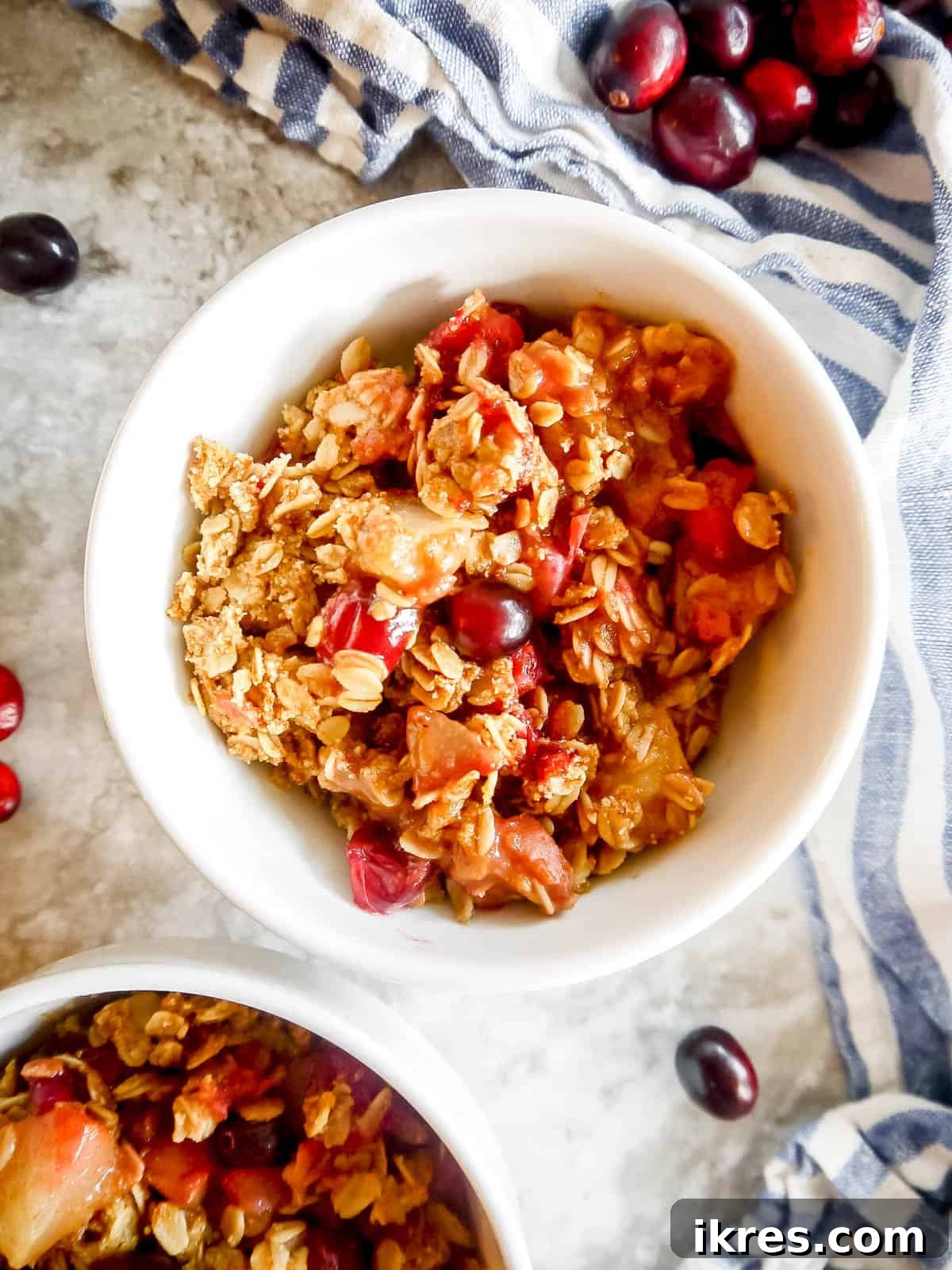 Spiced Pear Cranberry Crisp 9 A scoop of warm cranberry pear crisp in a bowl.