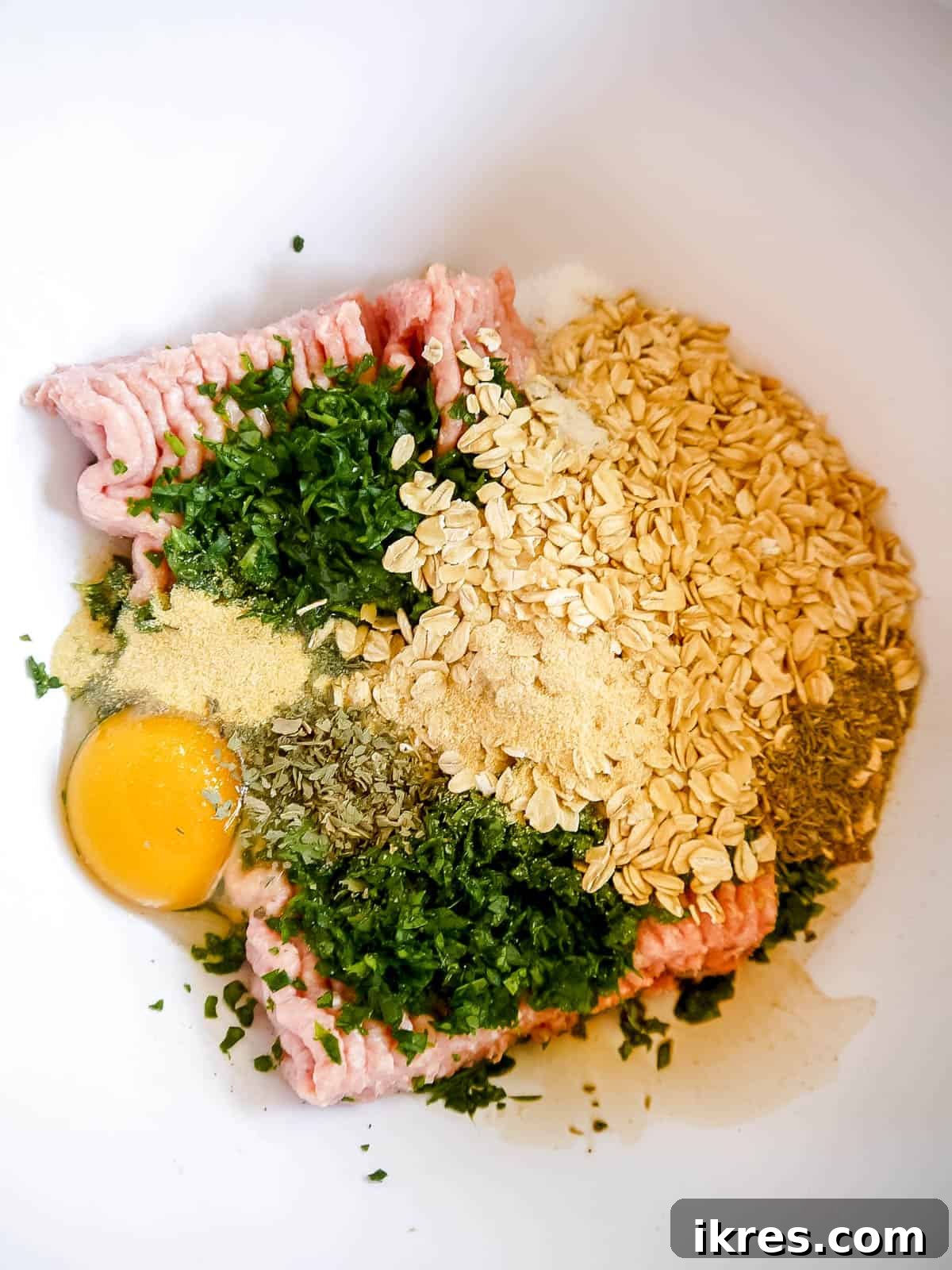 Lean & Green Baked Turkey Spinach Meatballs (Gluten-Free) 4 All turkey spinach meatballs ingredients in bowl before mixing.