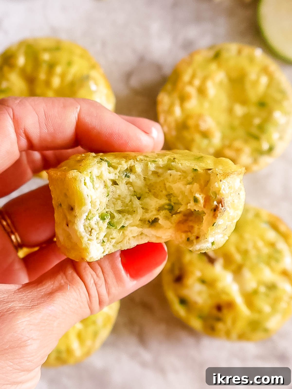 A bite taken out of zucchini egg muffins.