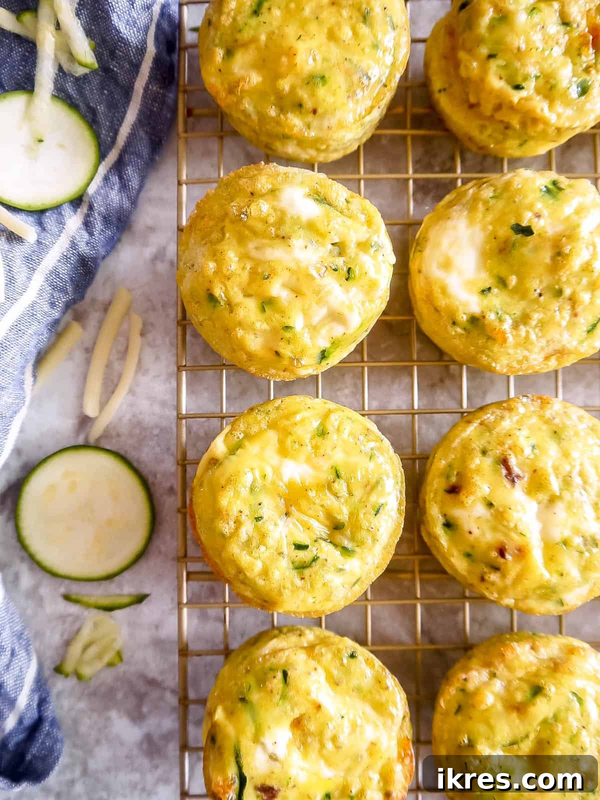 Zucchini egg cups on wire rack.