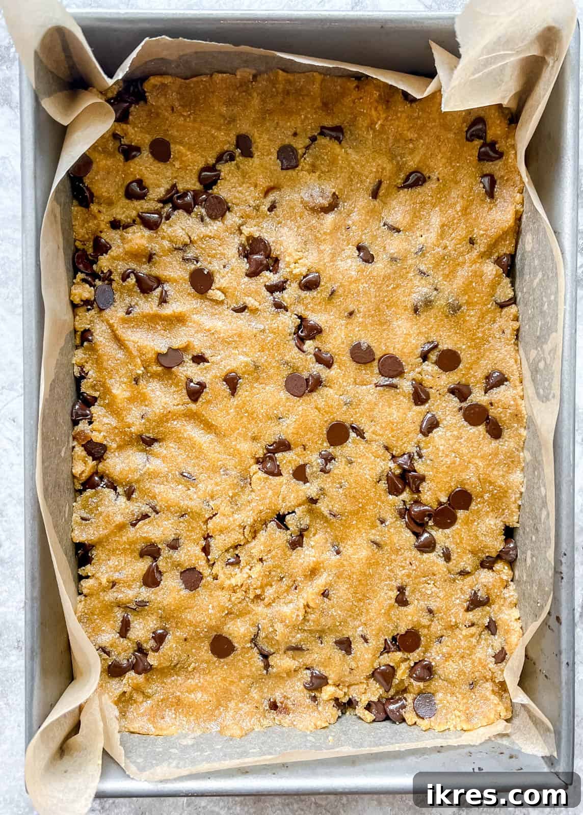 Golden Yolk Almond Chocolate Bars 7 Almond flour egg yolk cookie bar dough pressed into a baking pan, ready for the oven.