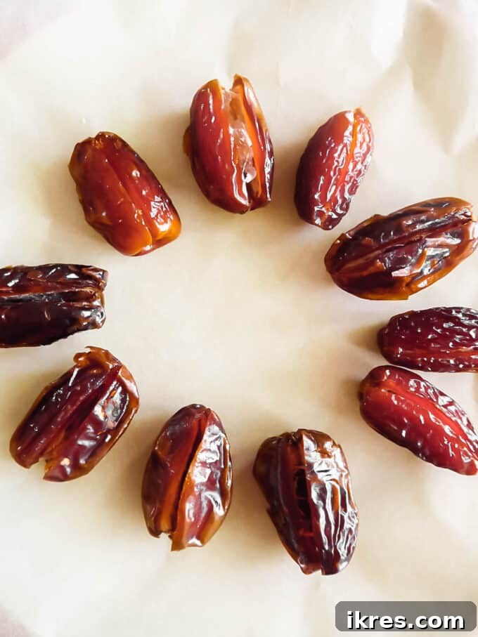 Medjool dates on a plate, ready for pitting.