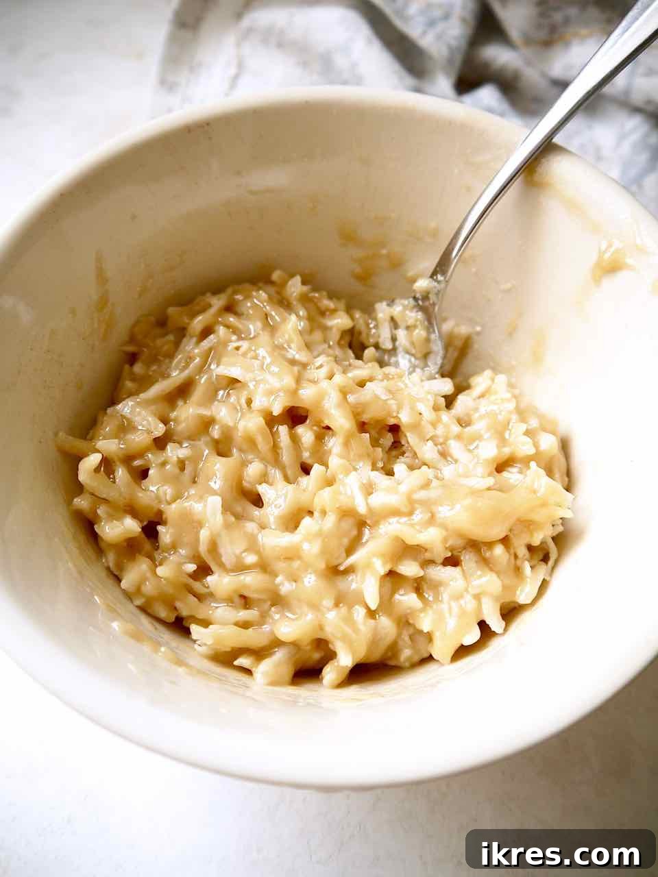 Paleo German Chocolate Cake Gluten and Dairy Free 5 Step 2: Mixing shredded coconut into caramel